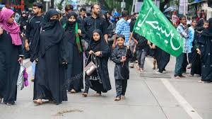 Shia Muslims take part in a Muharram ...