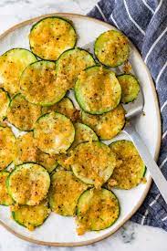 Crispy Baked Zucchini On A Serving Plate Zucchini Recipes Baked Easy Zucchini Recipes Zucchini Recipes