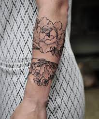 The dog has a crown of flowers as well as a lot of flowers underneath the tattoo. Great Placement And Design But I Would Prefer A Different Type Of Flower Band Tattoo Cuff Tattoo Arm Band Tattoo