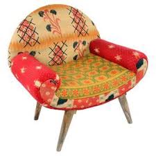 Pairing Midcentury Style With Bright Bohemian Appeal This Eclectic Accent Chair Showcases Kantha Cloth Upholstery And Tapered Ma Chair Accent Chairs Furniture