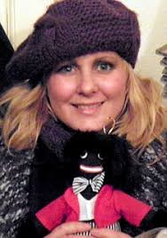 Tory husband wife posed with golliwogs