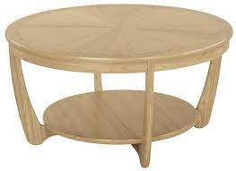 It provides a combination of modern and classic elements. Nathan Furniture Ltd Shades Oak Sunburst Round Coffee Table Coffee Tables Reynolds Furniture