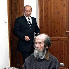 Putin and defense minister sergey shoygu are in a small wooden house in the middle of nowhere, with shoygu holding a small piece of wood and the president looking on. Putin Touts Russia S Achievements On Day Of National Pride The Spokesman Review