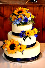 Top 5 Early Summer Navy Blue Wedding Ideas White Wedding Cake With Sunflowers And Navy Belly Ban Wedding Cake Navy Sunflower Wedding Cake Yellow Wedding Cake