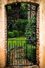 Through A Garden Gate In Charleston Garden Gates Garden Gates And Fencing Garden Doors