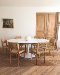 Add to favorites set of two tulip shaped flower vase with gold trim buds single flowers table decoration uniquearts22 4.5 out of 5 stars (310) $ 49.99 free shipping add to favorites. Atelier Vime Saarinen Oval Dining Table Wood Floors Woven Chairs White Walls French Country Katie Considers