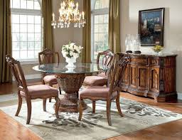 With sophisticated, traditional style, the charmond brown extendable dining room set from ashley brings taste and elegance to your dining room. Ashley Ledelle Round Beveled Glass Dining Table W 4 Uph Chairs Furniture Ashley Furniture Dining Room Modern Glass Dining Room Table Ashley Furniture Dining