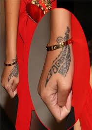 19 Magnificent Tattoos Sported By Rihanna And What They Mean Rihanna Tattoo Rihanna Hand Tattoo Celebrity Tattoos