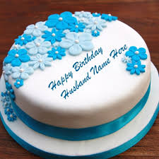 Birthday cakes are often layer cakes with frosting served with small lit candles on top representing the celebrant's age. Husband Birthday Cakes