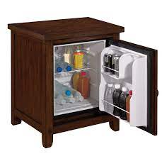 Affiliate links included for your convenience. Hide That Bulky Dorm Fridge In Your Home Or Office With This Beautiful Twin Star Fridge Cabinet Thehome Com Mini Fridge In Bedroom Dorm Fridge Bars For Home