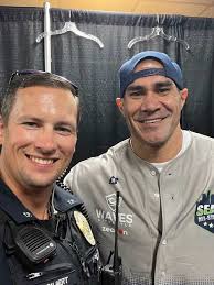 "CALL THE POLICE!" At the recent Seattle All-Star Classic, a star-studded,  community event supports local non-profit organizations, our own Officer K.  Gilbert gets temporarily pulled from his security ...