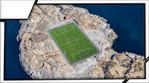 It has got no stands—just a couple of meters of asphalt poured around the field—and is used only for amateur football. Football Stadium In Henningsvaer The World S Most Awesome Football Stadium Youtube