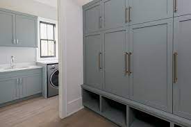 This is really beautiful and makes my heart sing a little 🙂 in our new home we have an entryway/mud room with a broom closet, and a 4′ wall of shallow pantry cabinets in our kitchen. Custom Gray Mudroom With Floor To Ceiling Built In Cabinets Featuring Brass Hardware And Lower Storag Mud Room Storage Mudroom Storage Cabinet Mudroom Cabinets
