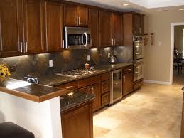 The Right Tile And Granite Combination Slate Backsplash Dark Granite Kitchen Tile Design Kitchen Backsplash Tile Designs Bamboo Kitchen Cabinets Backsplash