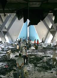 Palestinian take items from the burned ...