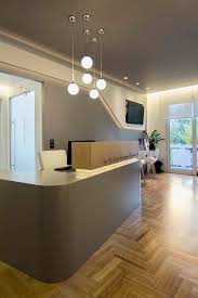 A dental office is more than a place of business. Dental Clinic In Athens By Architect Ioanna Polymenea Nice Front Desk Area Medical Office Design Medical Office Decor Clinic Interior Design