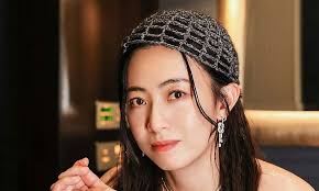 28-year-younger wife of Hong Kong's 5th-richest billionaire Joseph Lau  flaunts self-made knitwear paired with luxury brands