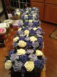 Bridal Shower Bouquets Instead Of Using The Typical Table Centerpieces That You Find At A Bridal Cupcake Flower Bouquets Cupcake Bouquet Cupcake Centerpieces