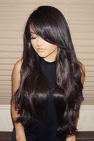 If you have an oval or round face with broad jaws, this hairstyle will complement your strong features especially well by completing it with soft, long layered hair with side bangs falling delicately along the side of your face. Becky G Straight Dark Brown Long Layers Overgrown Bangs Sideswept Bangs Hairstyle Steal Her Style Long Hair Styles Hair Styles Becky G Hair
