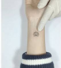 50 Latest Lotus Tattoo Unique Ideas Never Scene Before Simple Wrist Tattoos Flower Wrist Tattoos Lotus Tattoo Wrist
