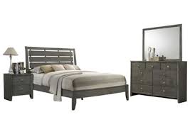 Whether you're buying a new house or you want to spruce up your existing bedroom, investing in a bedroom set is the best way to provide yourself with a comfortable sleeping environment that you'll treasure for years to come. Evan Grey King Bedroom Set Ivan Smith