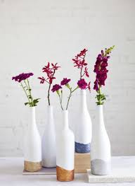 Color Block Glitter Vases With Bold Flowers Diy Bottle Crafts Wine Bottle Diy Crafts Wine Bottle Centerpieces