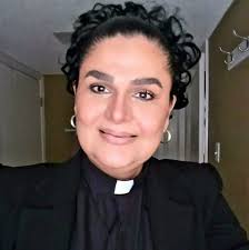 Rev Ian Alexander saves the day with a makeshift clerical collar for Very  Rev Dr Susan Brown to wear whilst delivering the Faith Impact Forum's  report.