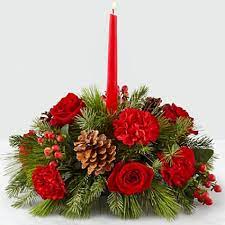 Holiday floral centerpieces are often at the core of a family's christmas decorations. The Ftd I Ll Be Home For Christmas Candle Table Centerpiece In Stratford On Flowers On York