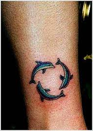 40 Stunning Dolphin Tattoo Designs And Ideas Dolphins Tattoo Dolphin Tattoo Design Mom Tattoos