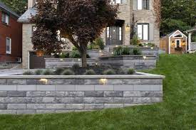 This patented system, exclusive to unilock®, is comprised of two basic components: Modern Unilock Retaining Wall Built With U Cara Paver Photos Landscaping Retaining Walls Modern Landscape Design Front Yard Front Yard Landscaping Design