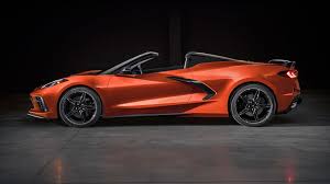 Young group having fun on beach playing guitar. 2020 Chevrolet Corvette Convertible Price How Much More Expensive Is It Than The Coupe