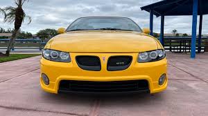 Image result for Yellow 2004 Pontiac