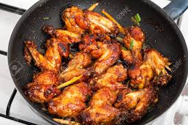 Pan fried chicken wings recipe in urdu. Closeup Of Asian Caramelized Chicken Wings Being Cooked In A Stock Photo Picture And Royalty Free Image Image 28674645