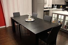 Its a very large dining table and is available with a huge choice of chairs and benches to suit your requirements. Transformer Extendable Dining Table Expands From Console Table To Large Dining Table Seating 10 Black Buy Online In Angola At Angola Desertcart Com Productid 35170093