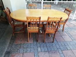 In this dining room from home.at.goldlay, a cool light gray acts as the canvas for bold oranges, yellows, and reds throughout the space. 6 Seater Oval Dining Room Suite Yellow Black Wood Junk Mail