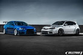 Subaru Impreza Wrx Sti Vs Mitsubishi Lancer Evolution X Mitsubishi Lancer Vs Subaru Wrx Mitsubishi Evolution Mitsubishi Japan Cars