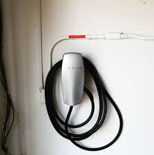 This Tesla Wall Connector Is Currently Using The Energy From The Sun To Power A Beautiful Model Solar Phone Chargers Solar Powered Phone Charger Solar Charger