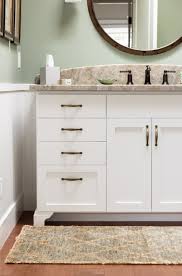 Modern materials used on the vanity add elegant warmth of hardwood that coupled with classic design of utilitarian beauty. Coastal Craftsman By The Bay Sligh Cabinets Inc