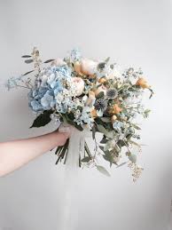 On their own, anemones feel modern, festive, and cheerful. Light Blue Sky Powder Baby Wedding Bride Bridal Bouquet Flowers Peach Orange Gold Accents W In 2020 Bridal Bouquet Flowers Wedding Flower Arrangements Wedding Bouquets