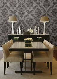 This dining room may feature traditional profiles for its trims and furniture, but it goes with a more contemporary shade and pattern of green for its wallpaper. Gorgeous Formal Dining Room Decor Idea With A Damask Wallpaper Feature Wall Dining Room Wallpaper Formal Dining Room Decor Dining Room Small