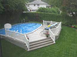 You can store all the stuff in the table that you dont want to leave out in case it rains. Above Ground Pools Decks Idea Brothers 3 Pools Family Owned Since 1960 Come See The Finest Pools Swimming Pool Decks Pool Deck Plans Above Ground Pool Decks