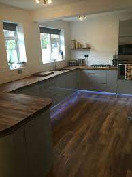 Shop everything for your home & more! Grey Gloss Handless Kitchen With Oak Worktop Industrial Chic Grey Gloss Kitchen Kitchen Cabinets Grey Worktop Kitchen