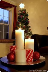 Christmas Candle Centerpiece With A Charger Pillar Candles And Pretty Ornament Christmas Candle Decorations Christmas Candles Diy Christmas Candle Centerpiece