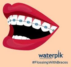 Thread the floss behind the brace wire. 19 Flossing With Braces Ideas Flossing Waterpik Water Flosser