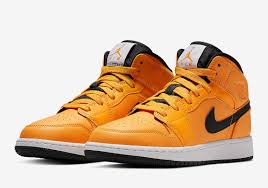 Black And Orange Air Jordan 1 Mid The Air Jordan 1 Mid Gets A Full Bright Taxi Yellow Sneakernews Com Air Jordans Jordans Jordan 1 Mid