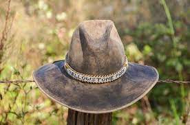 Vintage Distressed Western Hat With Beaded Yellowstone Park Etsy In 2021 Hat Band Western Hats Black Cowboy Hat