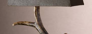 This lamp has a burnished bone ivory finish with a crackled wood tone base and cast aluminum accents. Stag Horn Lamp Carolyn Kinder International