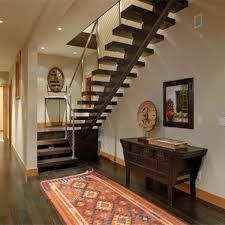 A metal spiral staircase is a good alternative to the wooden type. Indoor Iron Straight Staircase With Metal Frame And Wood Step