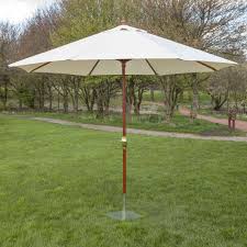 Alfresia Attractive Wooden Garden Parasols Are The Perfect Way To Add Colour And Style To Your Garden W Wooden Garden Furniture Patio Umbrellas Market Umbrella