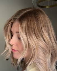 A soft blonde transformation for my Spring friend @coachcarrington ✨, We  rooted her with a warm dark blonde, refreshed the face frame, and glazed  everything with a touch of warm apricot. The result is ...